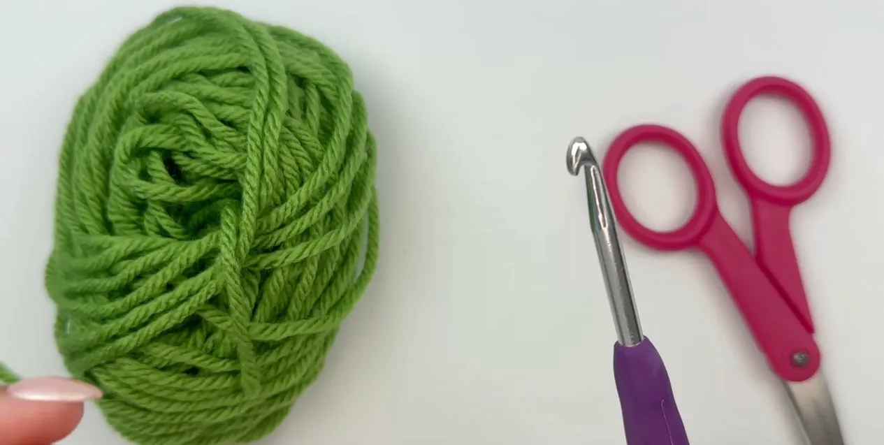 Yarn, hook, and tools used to practice the magic circle