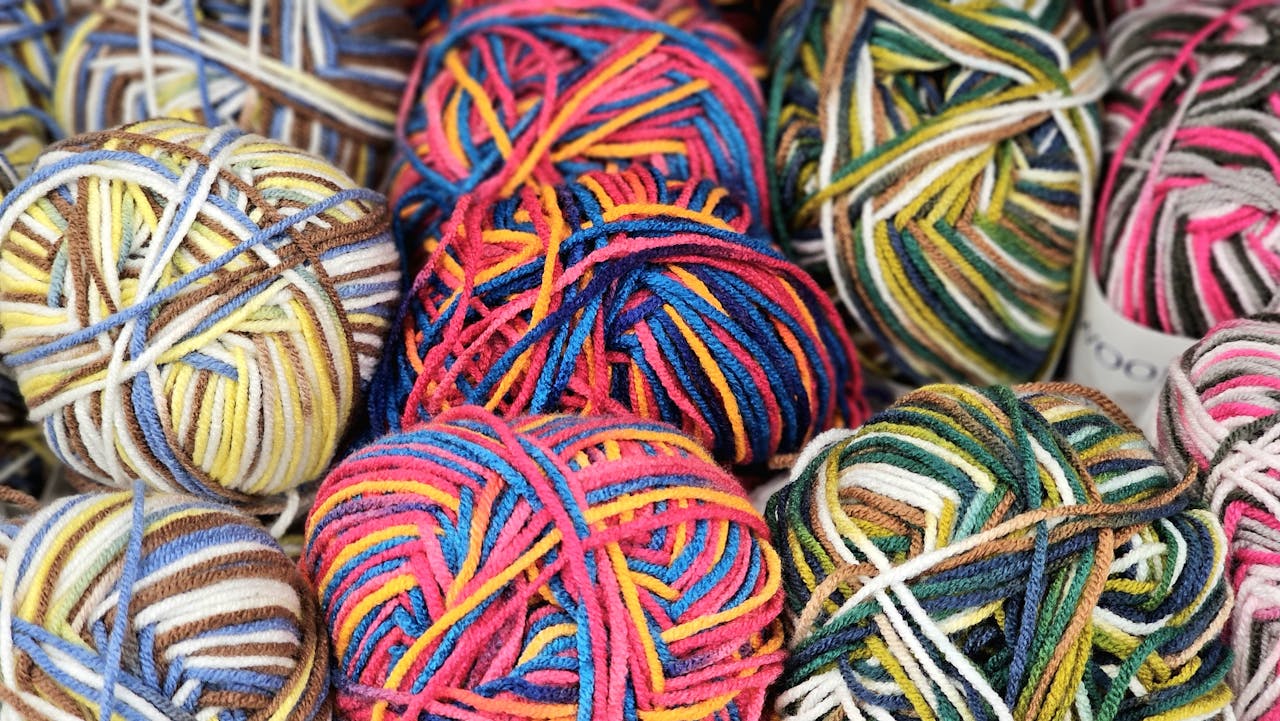 crochet baby blanket colorful pastel yarn skeins for nursery projects