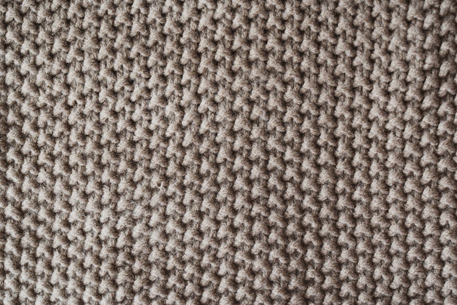 Textured knitted wool fabric showing stitch detail for granny cluster inspiration