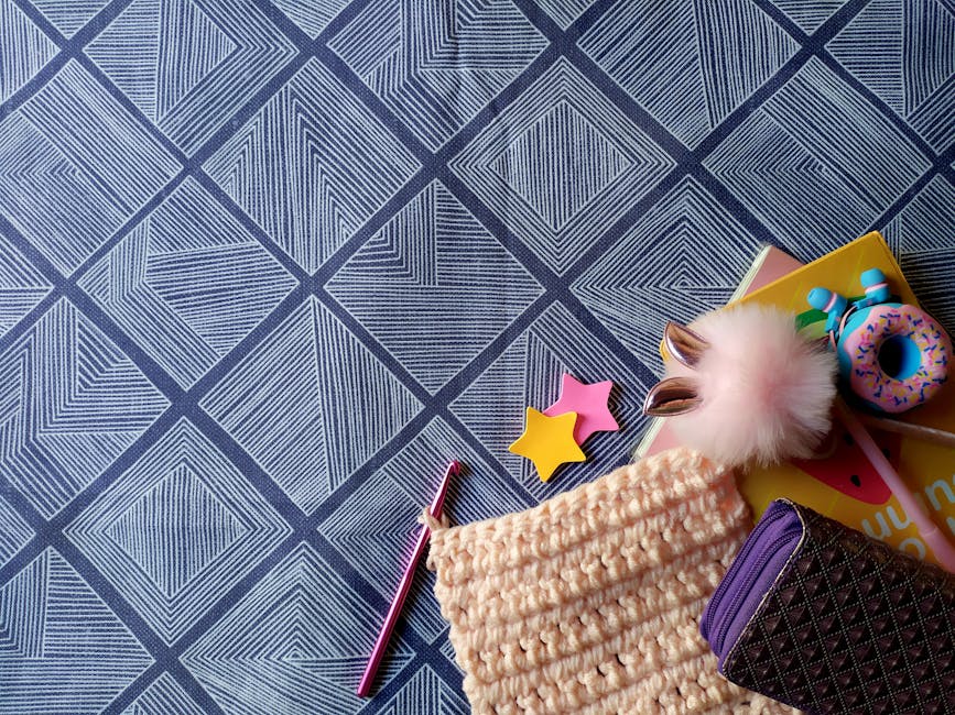 artistic flat lay of crochet work and colorful yarn perfect for a crochet beanie project