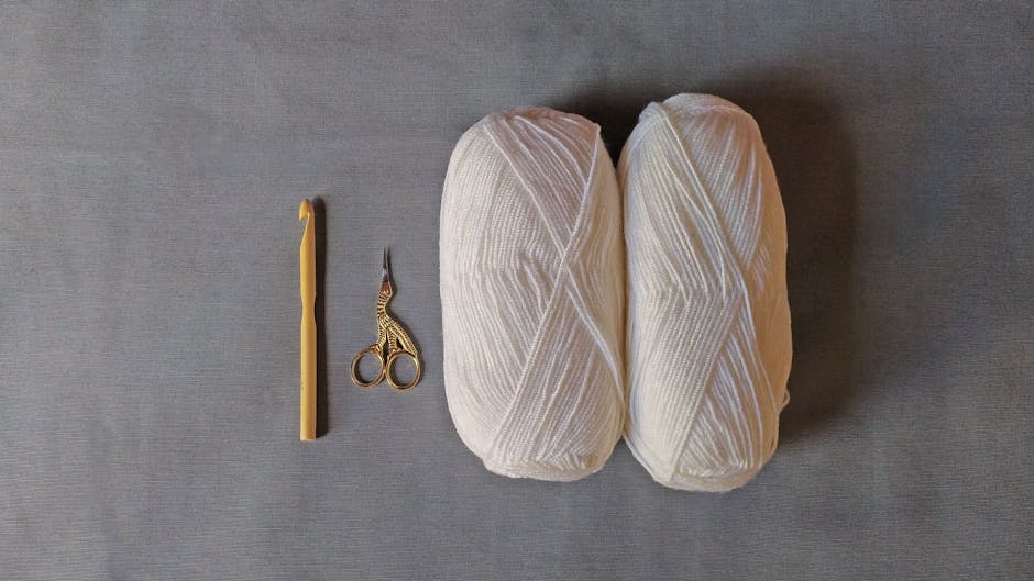 crochet hook and yarn on a minimalist flat lay showing how to make a crochet beanie