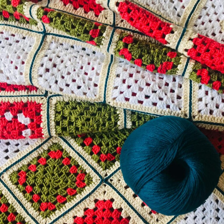 colorful crochet granny square pattern with yarn