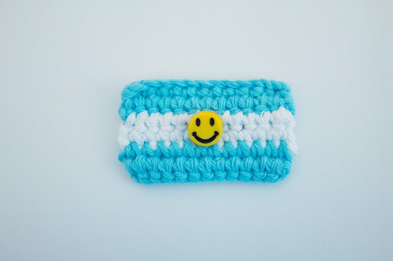 crochet phone case pattern with blue and white handmade design