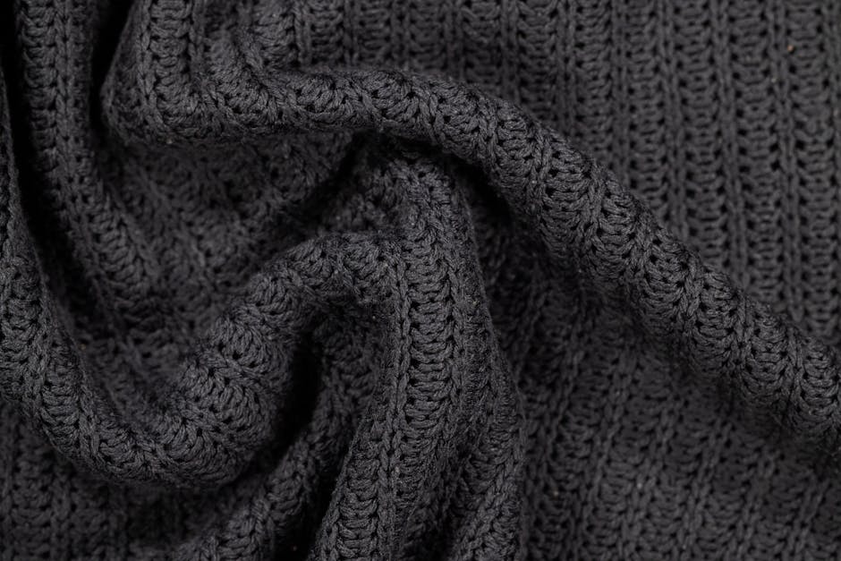 Cropped crochet sweater fabric texture detail