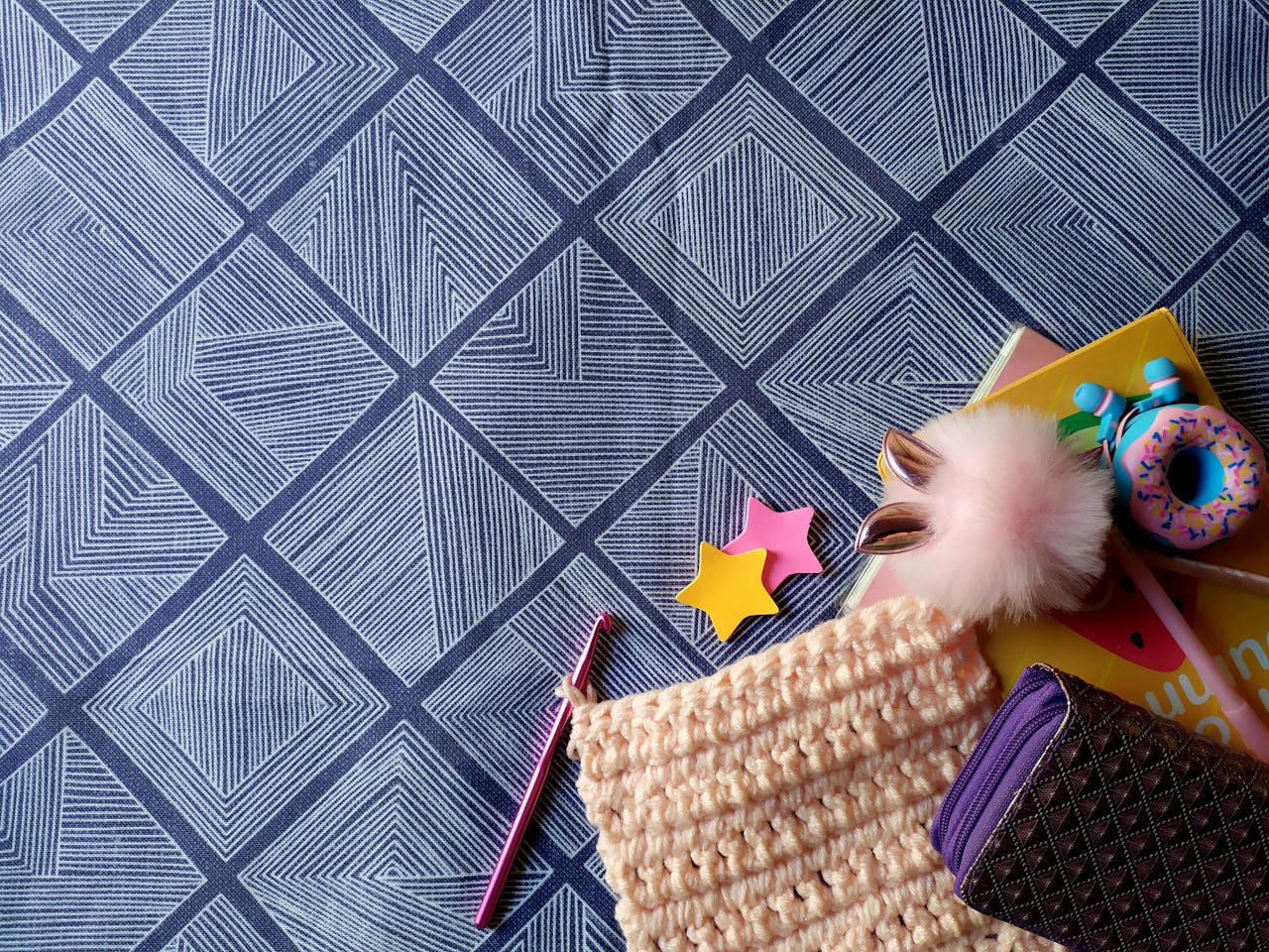 crochet phone case with colorful yarn and accessories