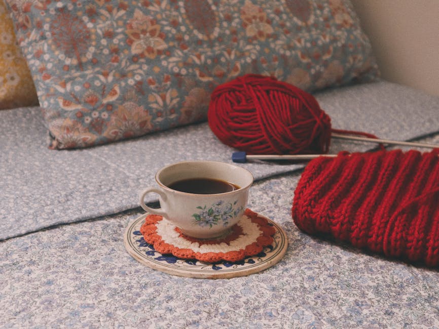 granny square cushion pattern project with colorful yarn supplies