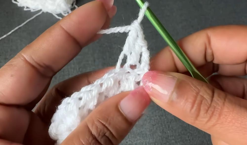 Close-up of the cross V stitch used in this crochet top pattern showing the openwork texture