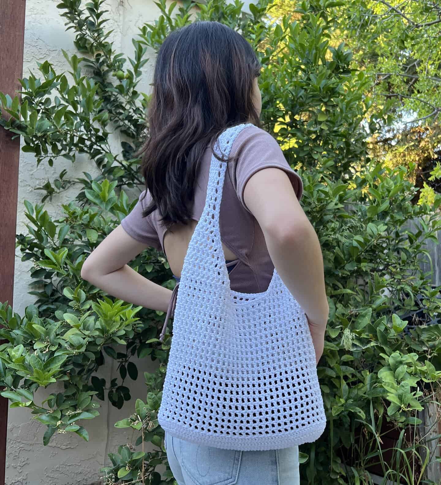 crochet mesh tote bag styled flat lay