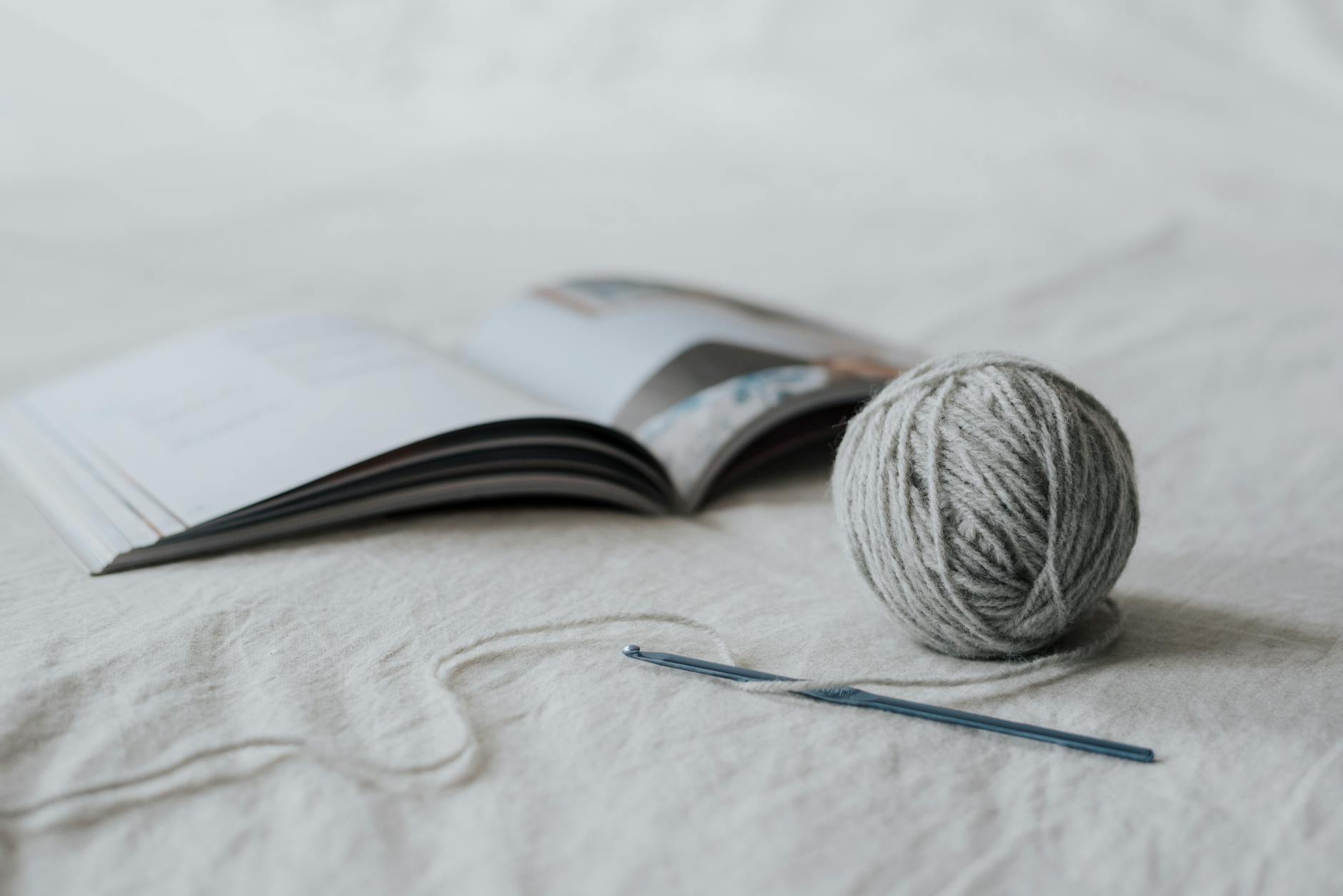 Yarn and crochet supplies for a cloud crochet cardigan pattern