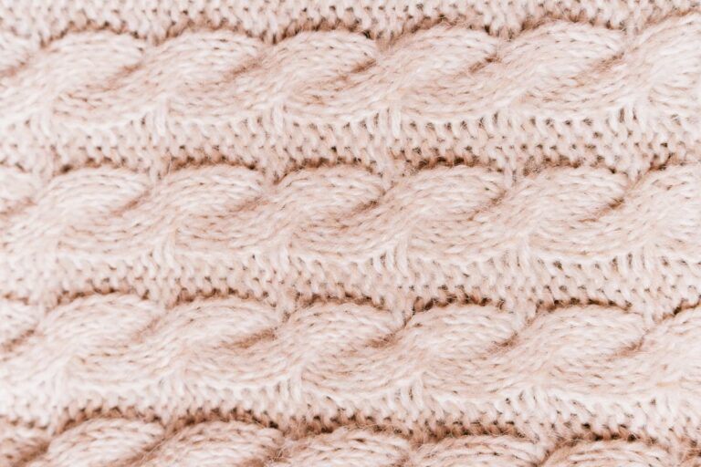 Colorful crochet vest yarn textures showing intricate knit patterns for layering