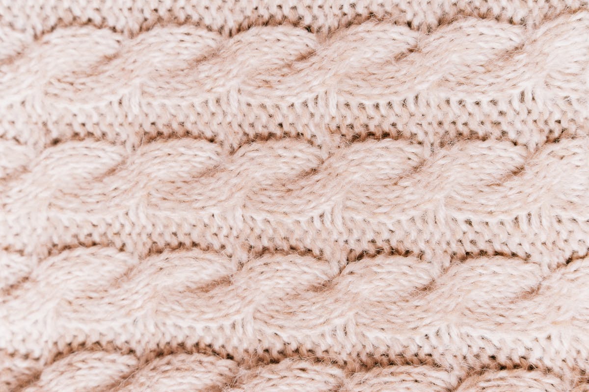Colorful crochet vest yarn textures showing intricate knit patterns for layering