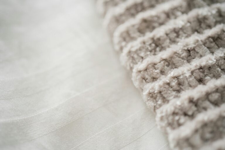 Fluffy white yarn and chenille texture close-up showcasing the soft crochet lounge pants pattern material