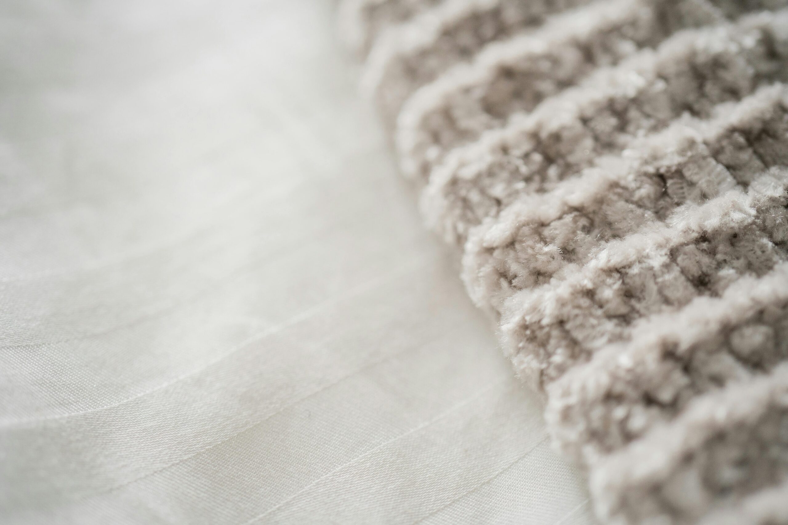 Fluffy white yarn and chenille texture close-up showcasing the soft crochet lounge pants pattern material