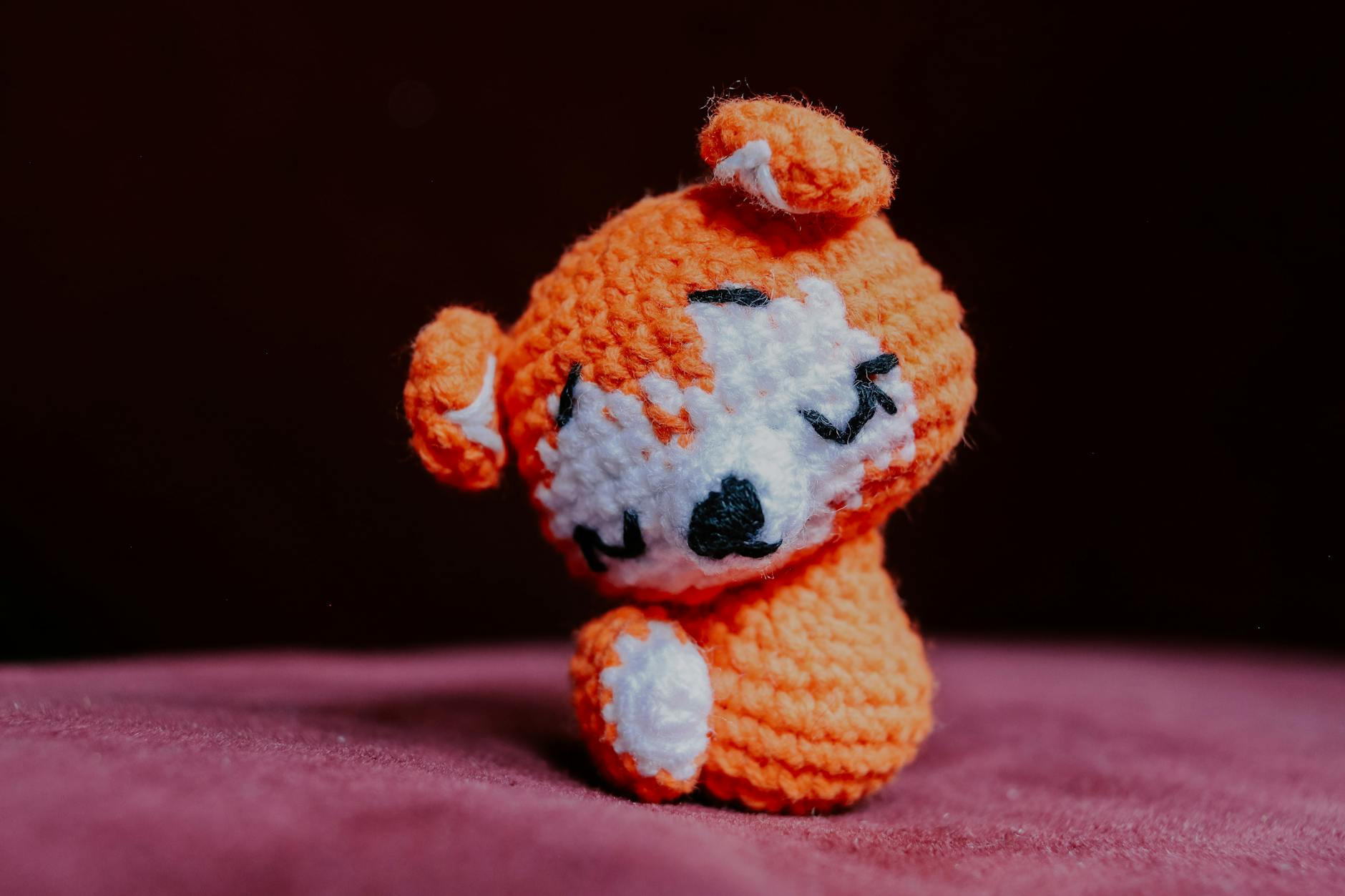 crochet mothers day gifts - Adorable handmade orange crochet animal figure on a soft pink surface, perfect for cute and cozy 