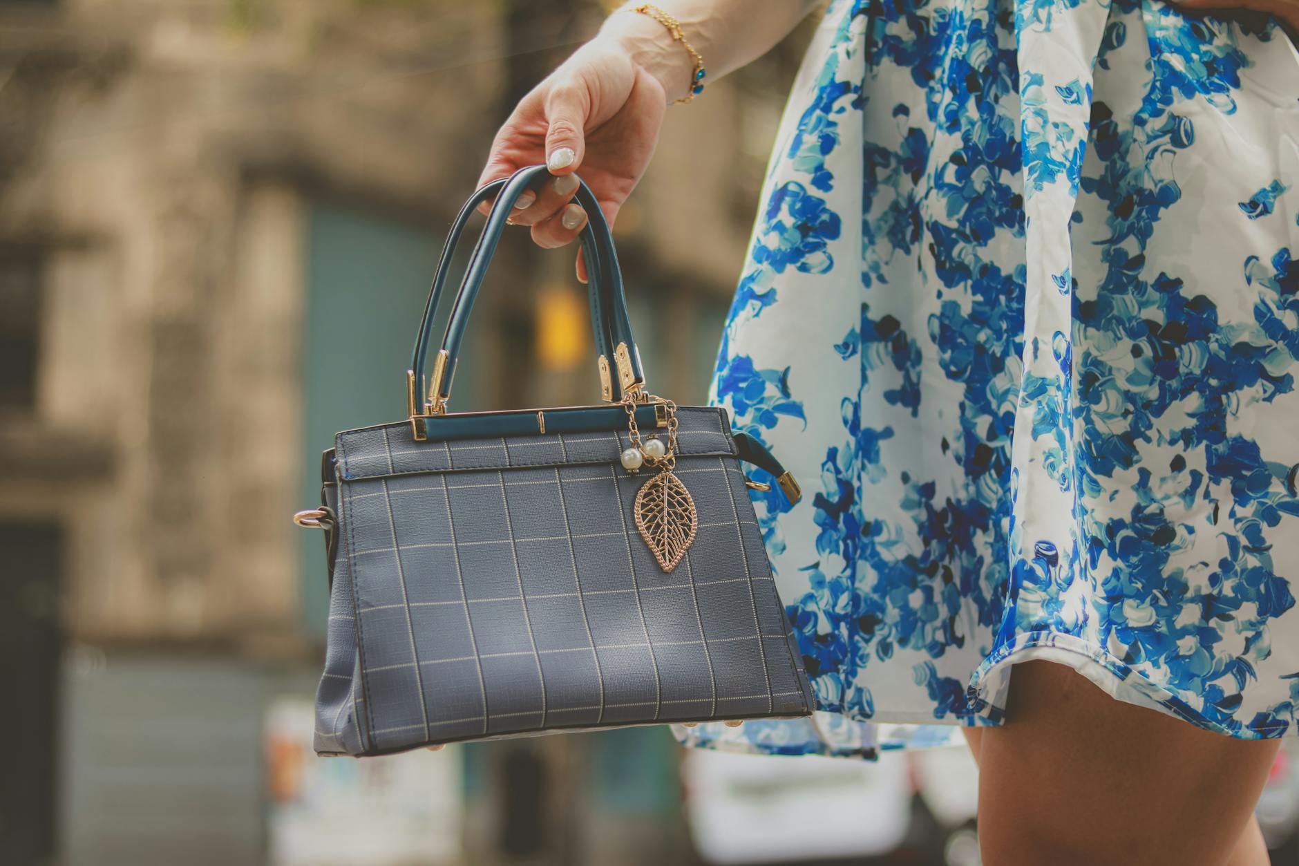 crochet handbag patterns guide - Elegant blue handbag and floral dress detail, perfect for fashion-forward styling on the go.