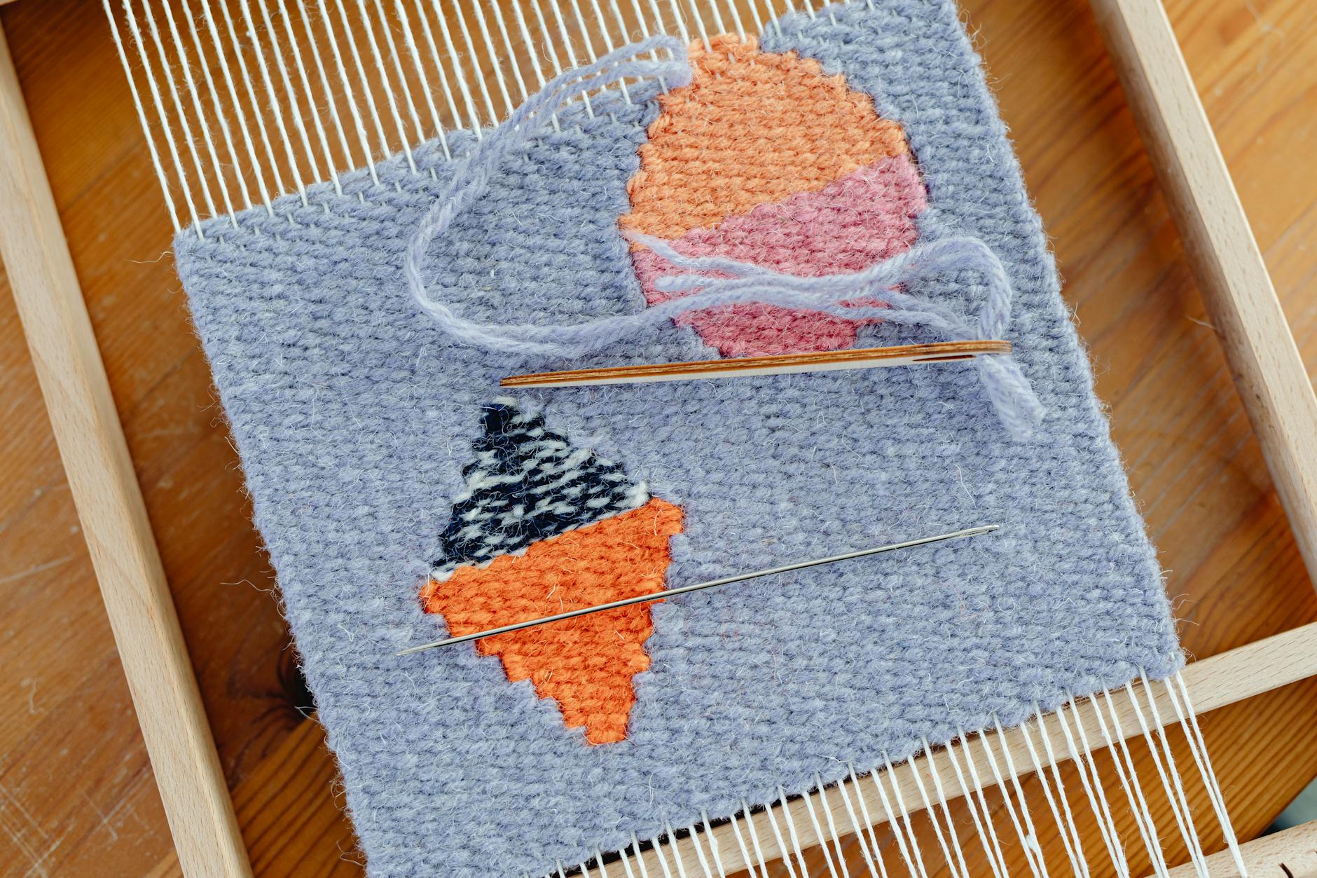 weaving in ends - Close-up of a handmade tapestry featuring ice cream cone designs in vibrant colors on a ...