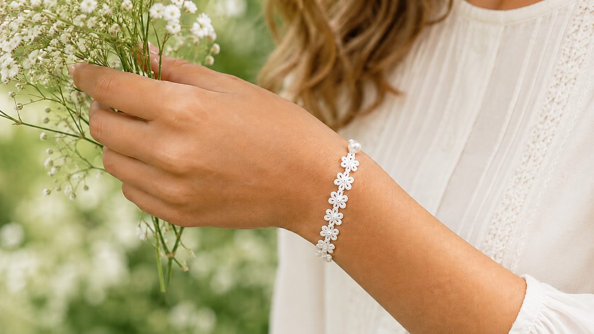 Styled shot of the crochet flower bracelet pattern worn on a wrist