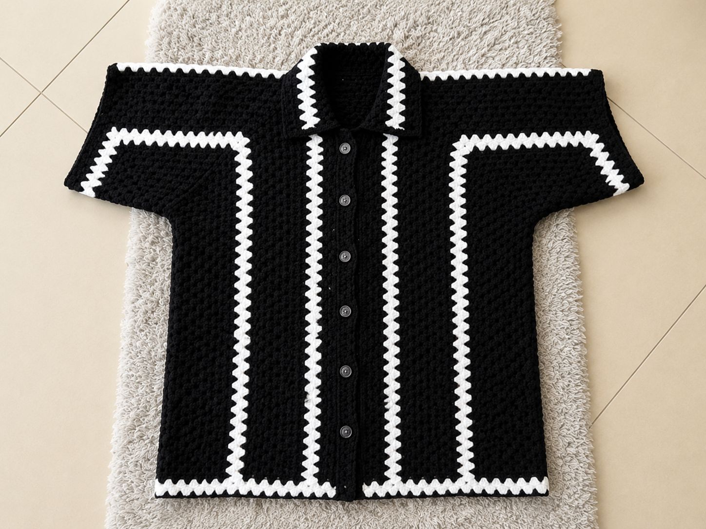 Finished crochet hexagon shirt for men with black base white zigzag trim and button front closure