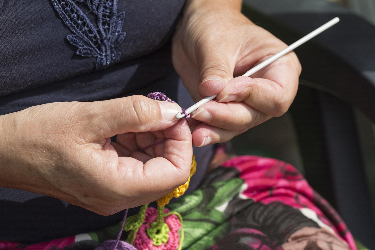 Hands working crochet needlework