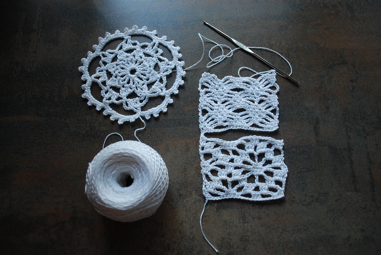 White crochet doily with hook
