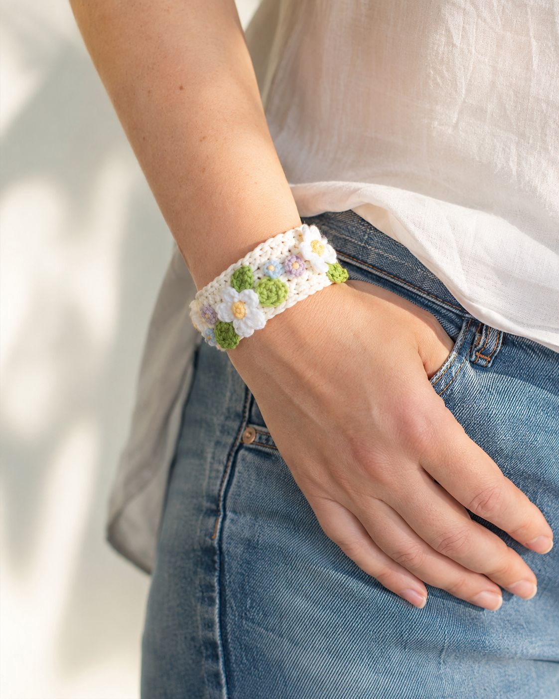 Floral crochet cuff bracelet with white green and pastel flowers