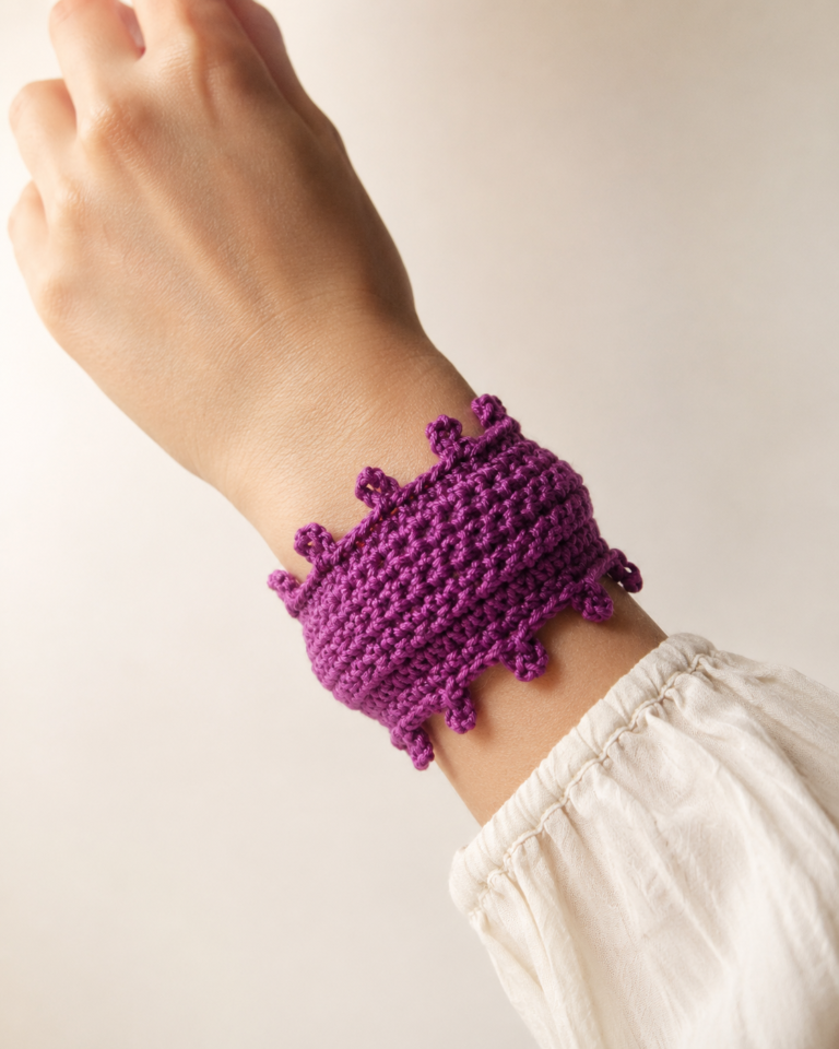 Wide purple crochet cuff bracelet with scalloped edges