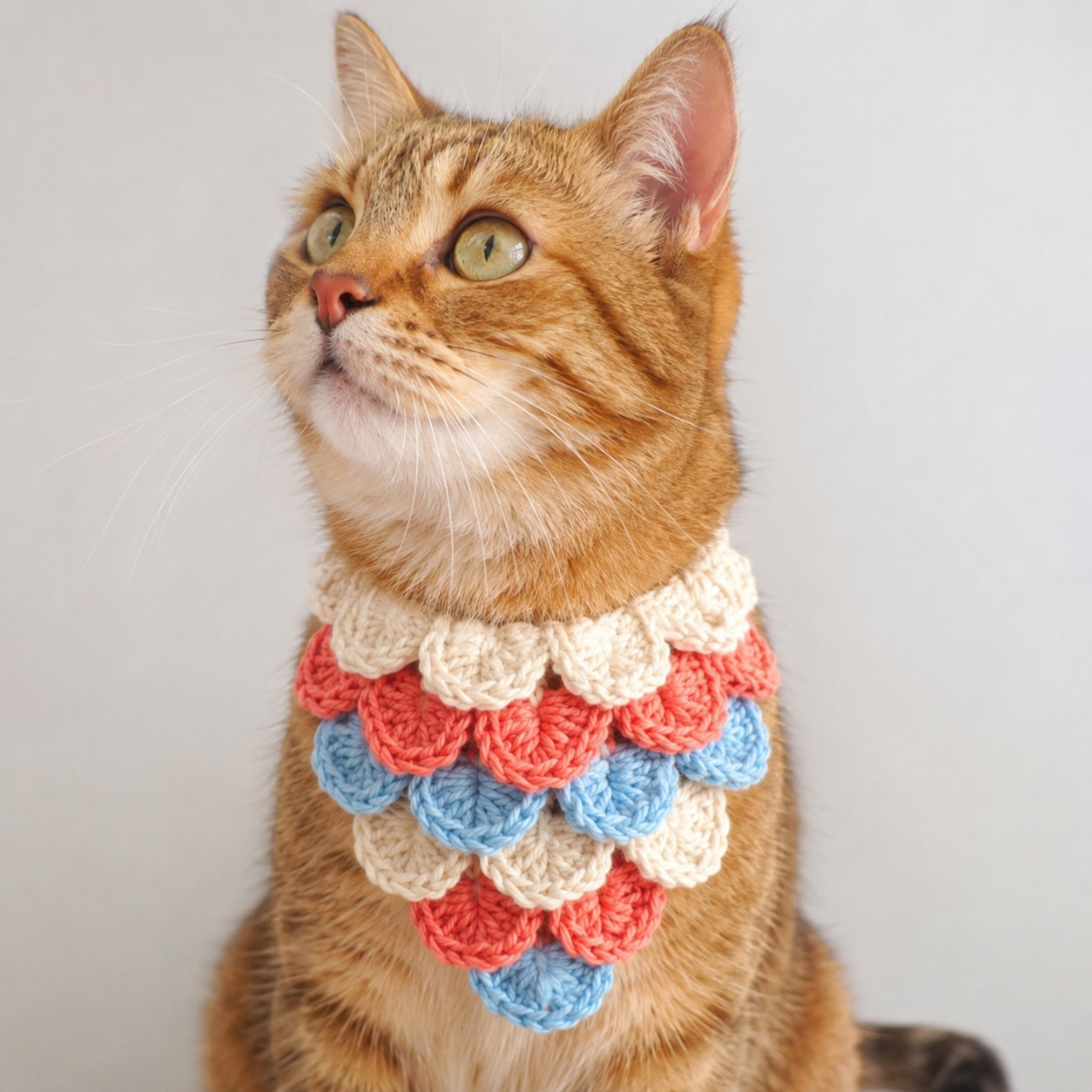 Crochet mermaid scale cat bandana in cream coral and blue