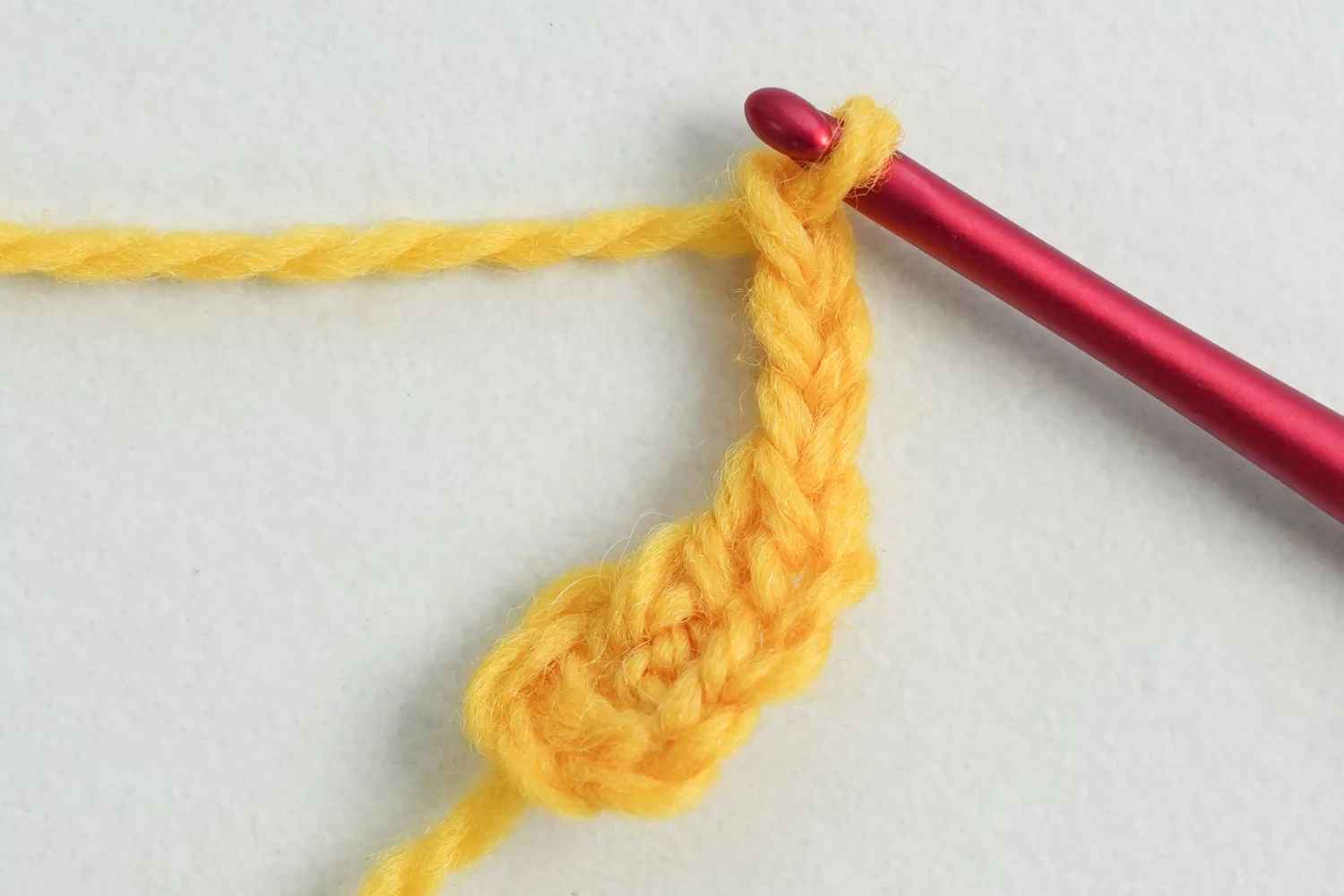 3D flower granny square round 2 showing yellow bobble stitch center