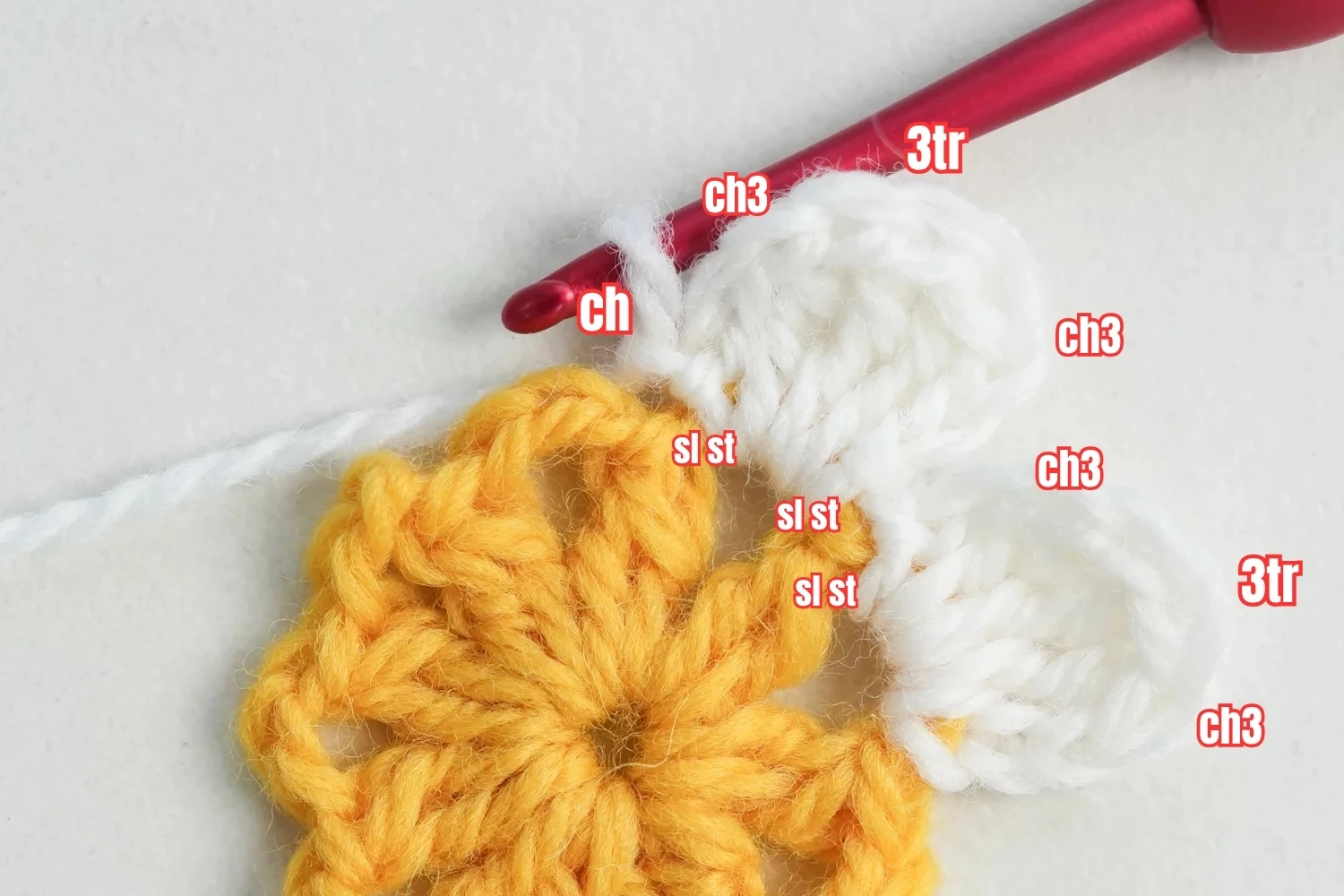 3D flower granny square rounds 2-4 showing petal layer and connecting round