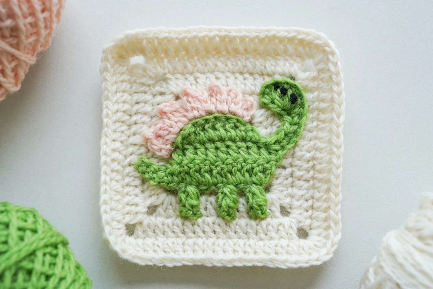 Completed dinosaur granny square with all details