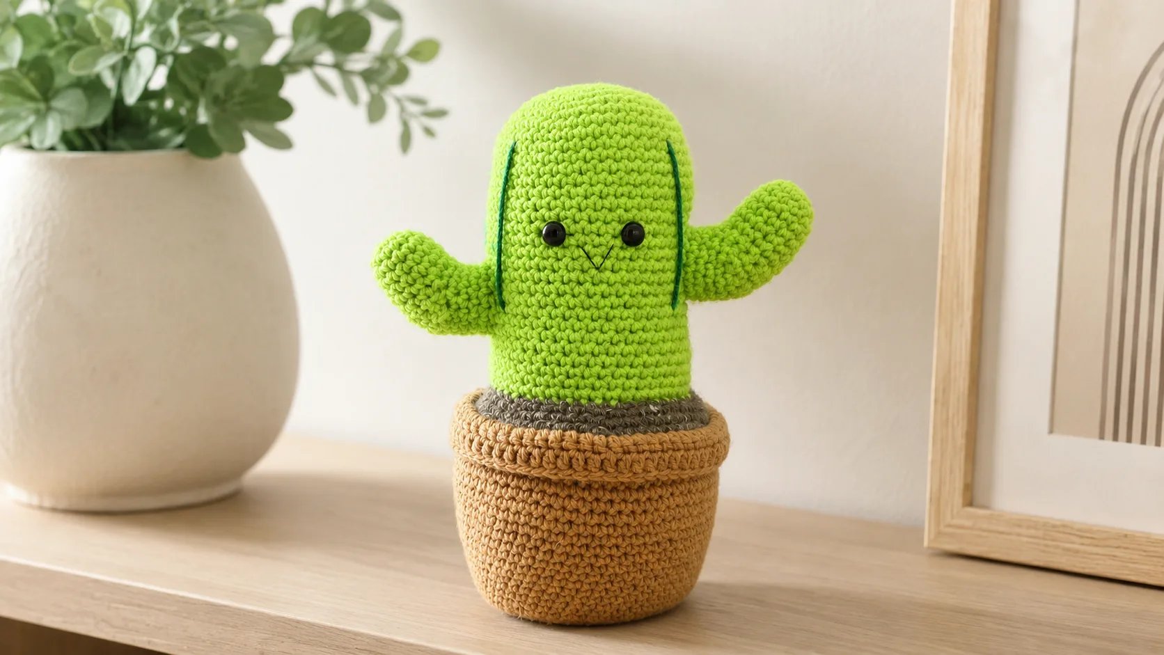 Handmade crochet cactus in a tan yarn pot