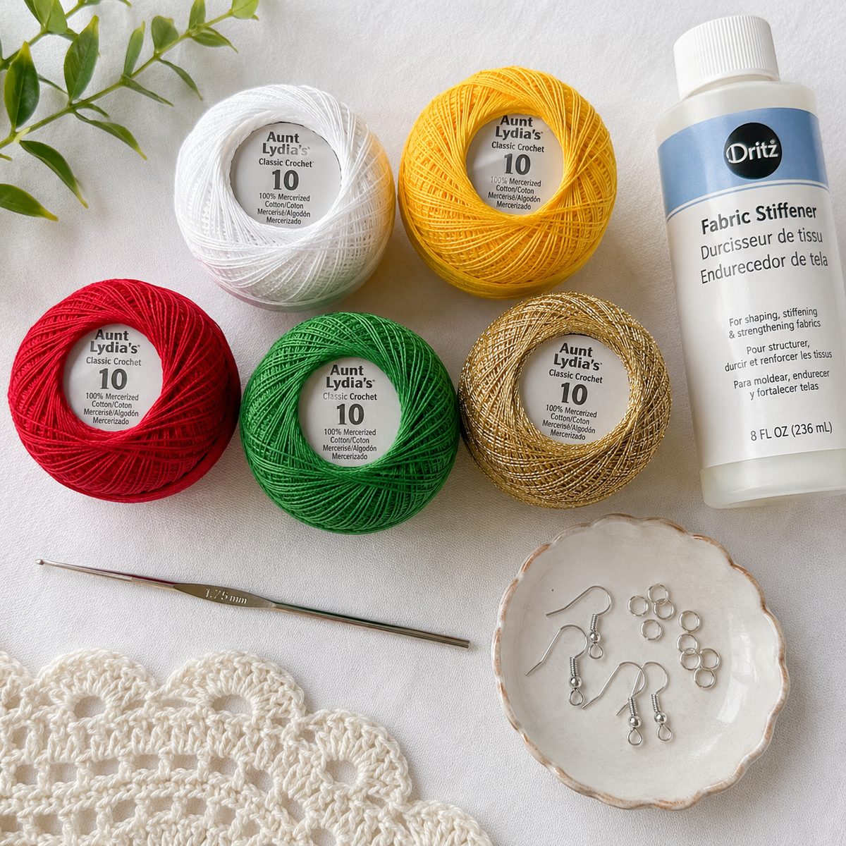 Size 10 crochet cotton in five colors with a 1.75 mm steel hook, fabric stiffener, earring hooks and jump rings
