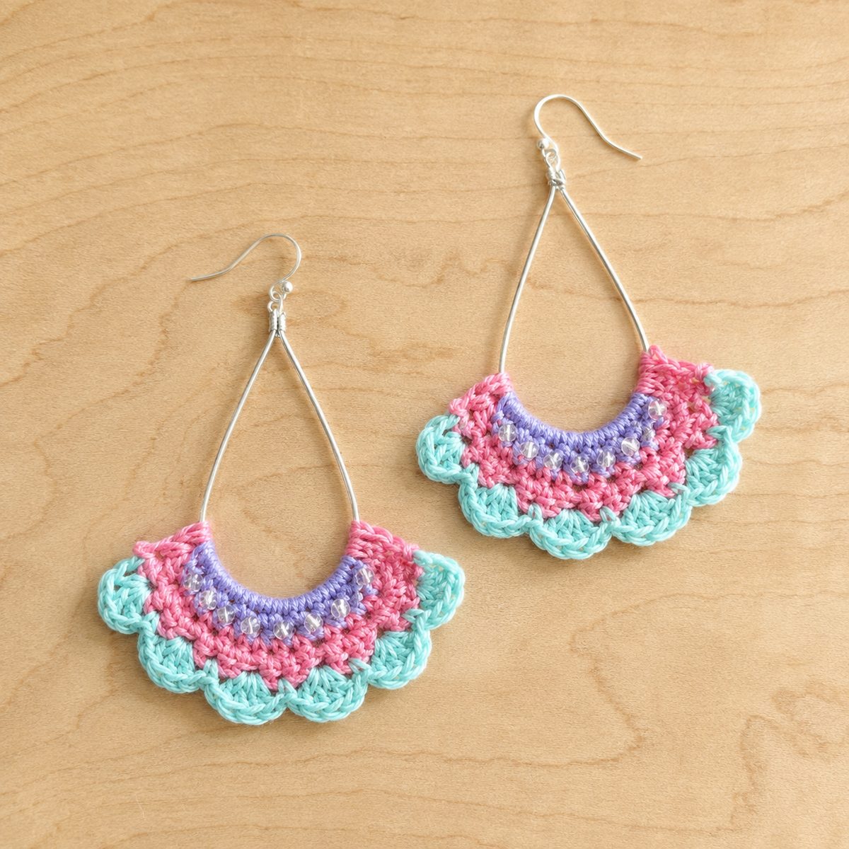 Pink, mint and lilac crochet fan earrings with tiny beads hanging from silver teardrop hoops