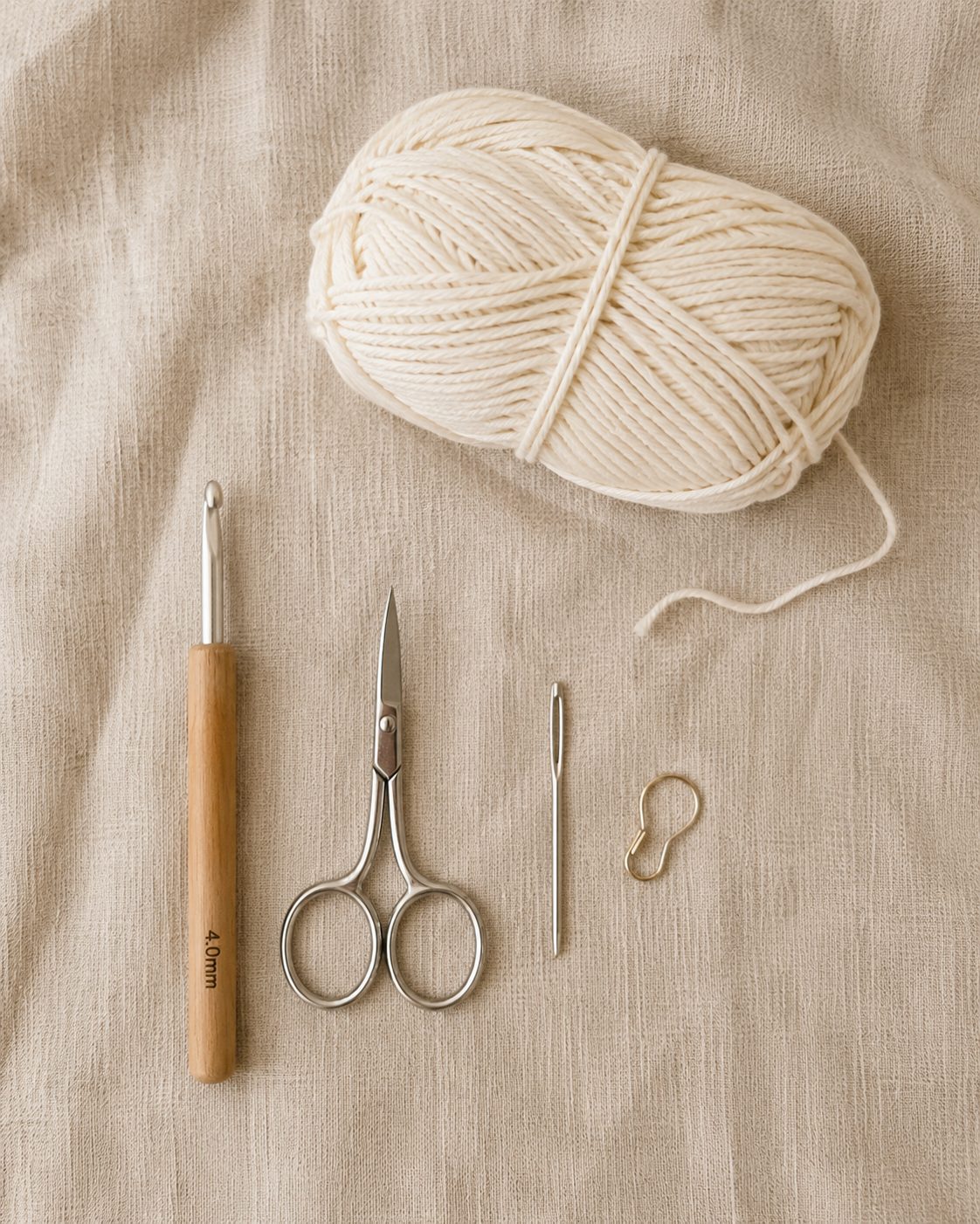 Materials for the crochet mesh hat, worsted cotton yarn, 4 mm hook, scissors, yarn needle and stitch marker