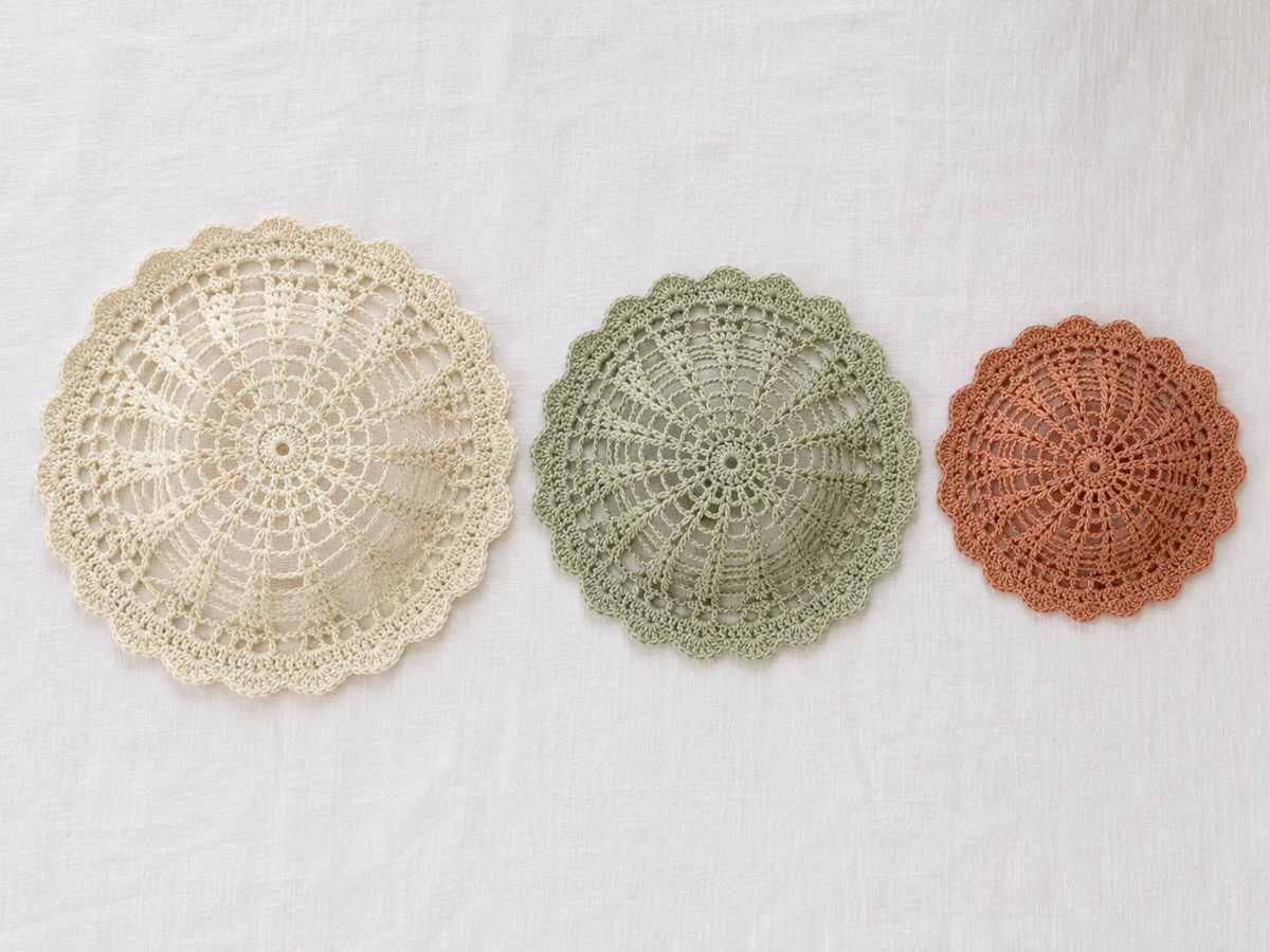 Three crochet mesh hats in cream, sage and terracotta cotton, small, medium and large