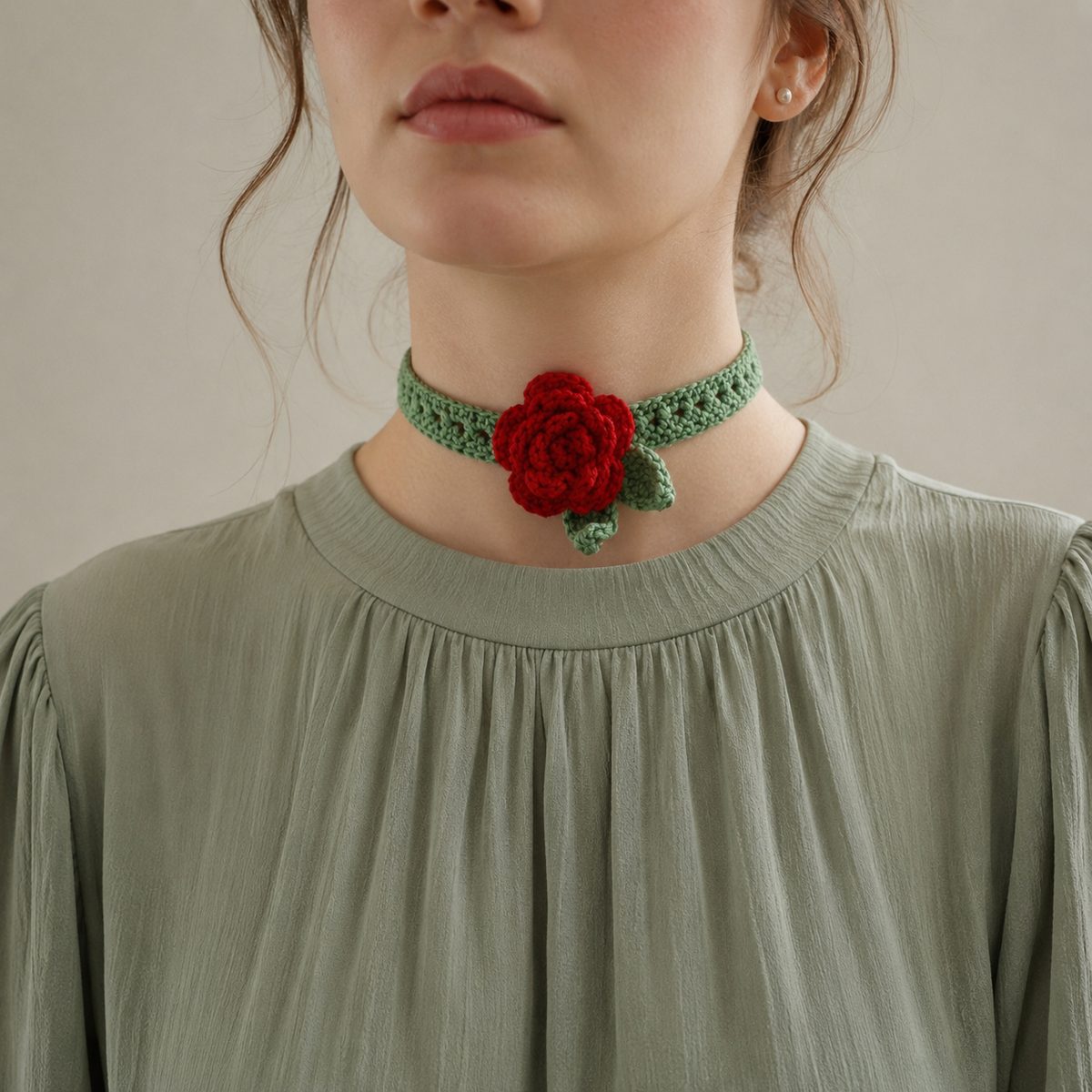 Sage green crochet choker band with a layered red rose and leaf