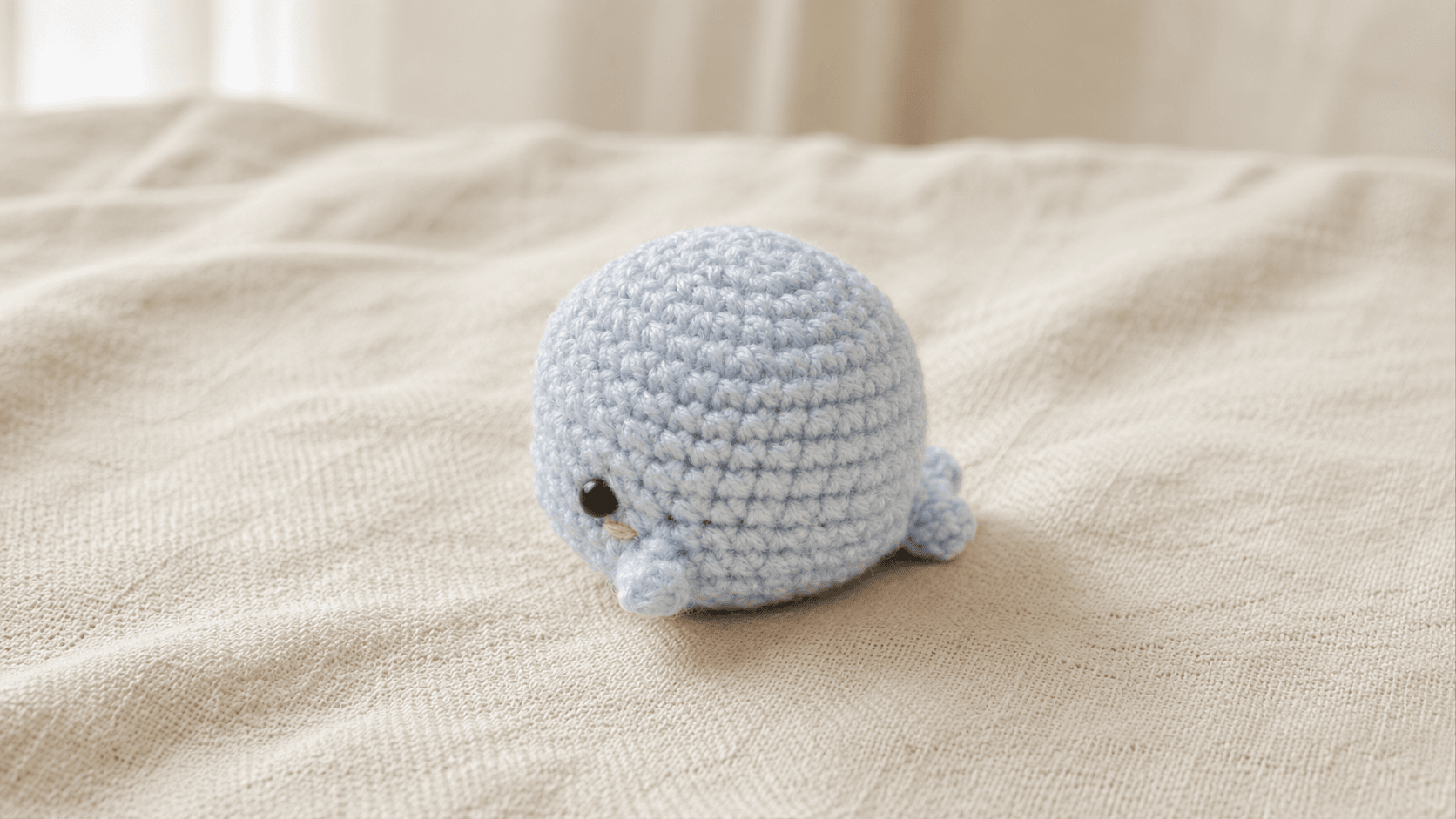Plain grey and blue round crochet amigurumi whale