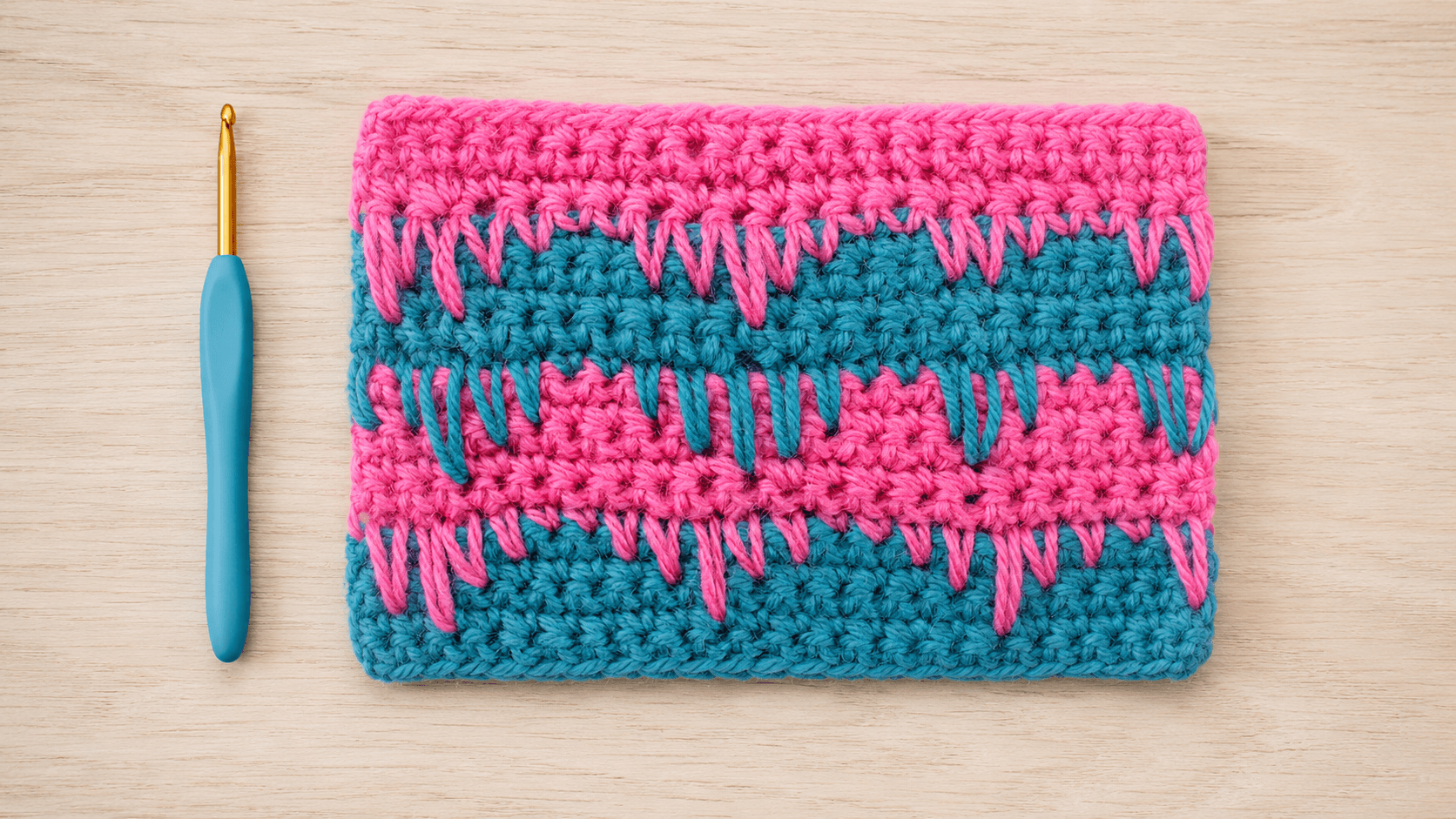 Pink and teal crochet spike stitch swatch