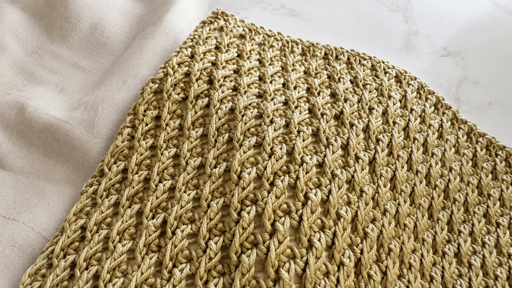 Gold crochet alpine stitch dishcloth close-up swatch