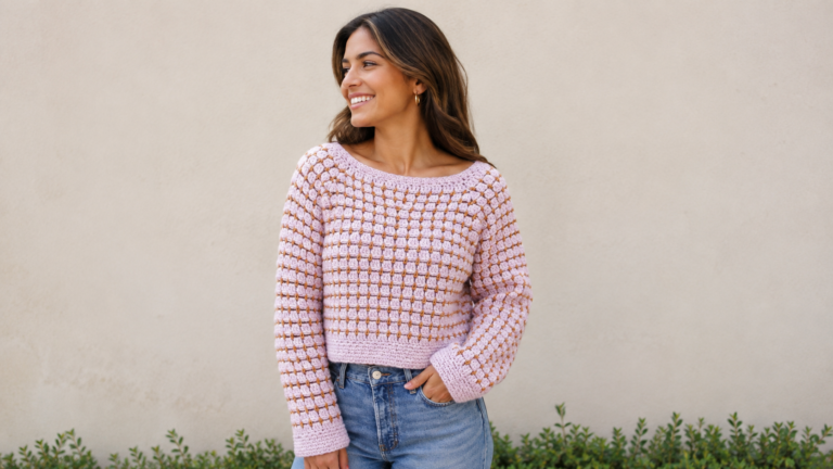 Adult wearing a pink handmade cropped crochet sweater