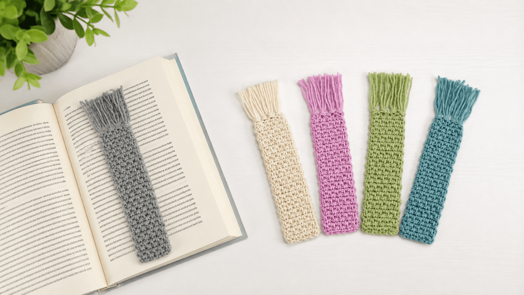 Colorful crochet bookmarks with fringe tassels on a book