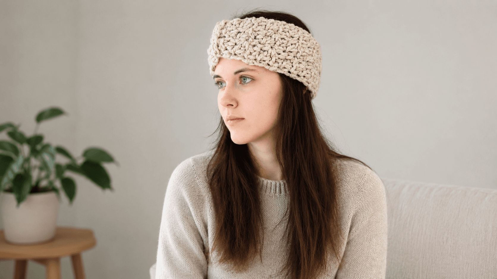 Woman wearing a cream textured crochet headband