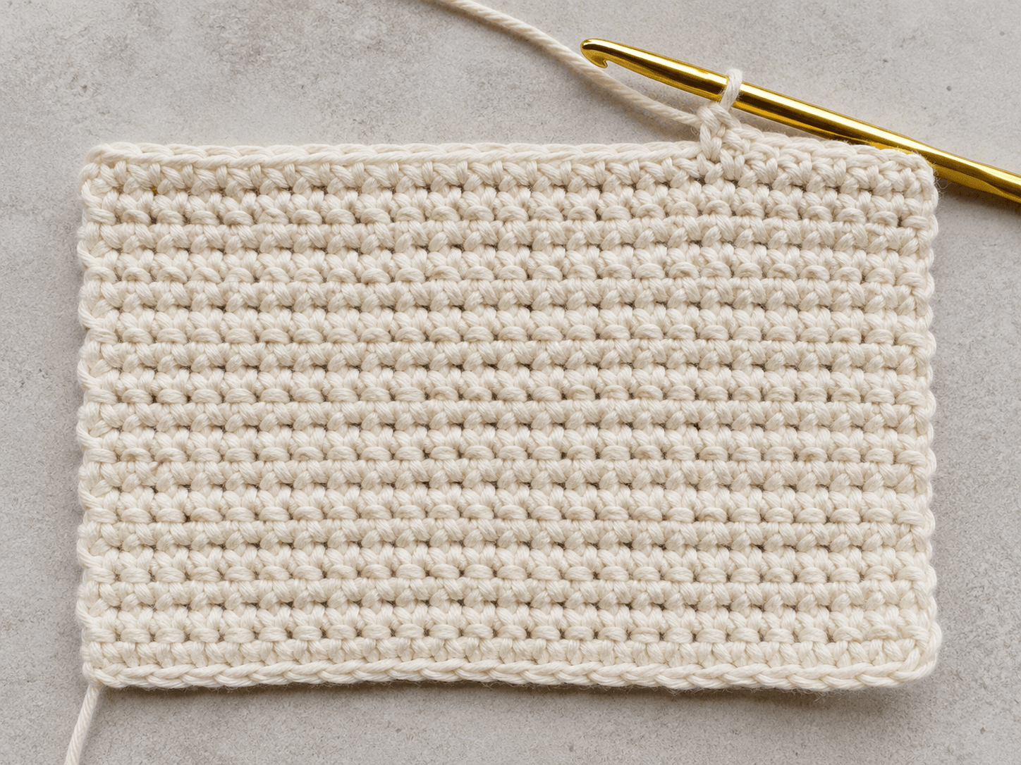 How to Single Crochet (tutorial) - detail shot: A flat swatch of single crochet fabric rows