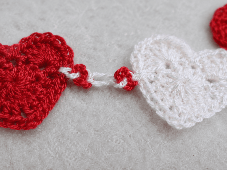 Linked Hearts Crochet Bracelet - detail shot: Extreme close-up of one linked heart connection point
