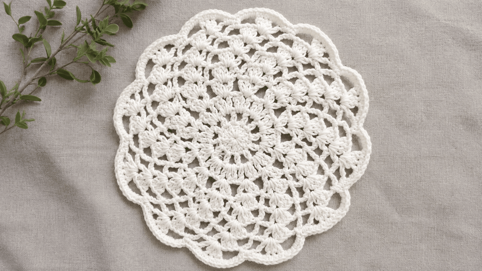 White crochet doily with scalloped flower-petal edging